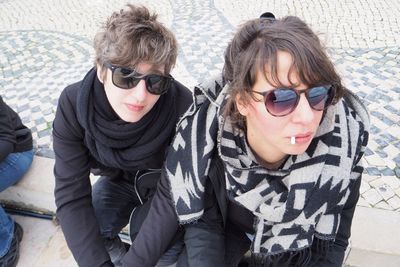 High angle portrait of happy friends sitting outdoors