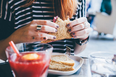 Close-up of hands holding sandwich