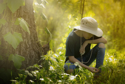 Woman sitting on field