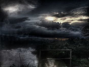 Storm clouds over city at night