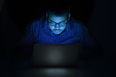 Young woman using laptop at home