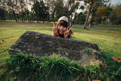 Portrait of a smiling young woman on land