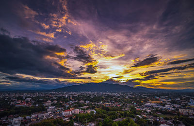 High angle view of buildings against sky at sunset