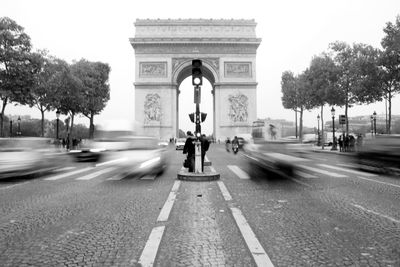 Road along trees in city