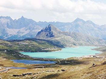 Scenic view of lake and mountains against sky