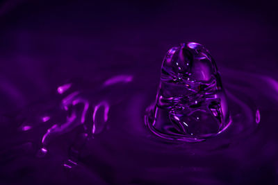 Close-up of water drop on glass