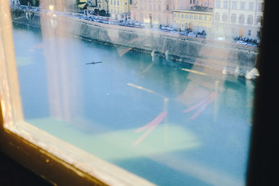 Reflection of city on glass window