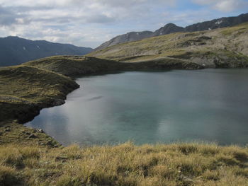 Scenic view of landscape and mountains against sky