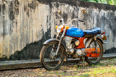 Bicycle parked against wall