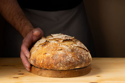 Midsection of man preparing food