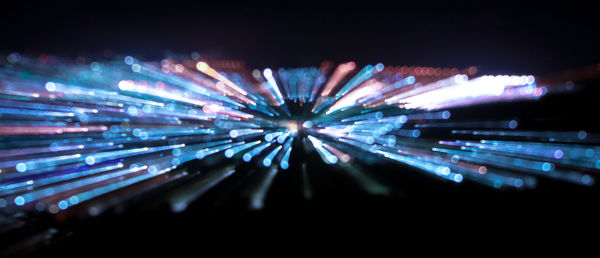 Defocused image of illuminated lights at night