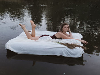 Woman lying in lake