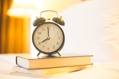 Close-up of clock on table