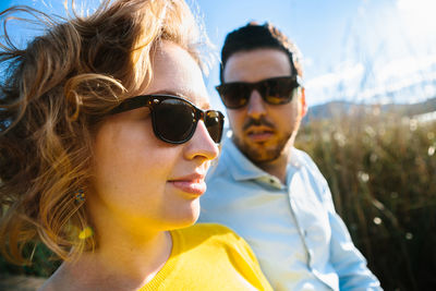 Portrait of smiling young man wearing sunglasses