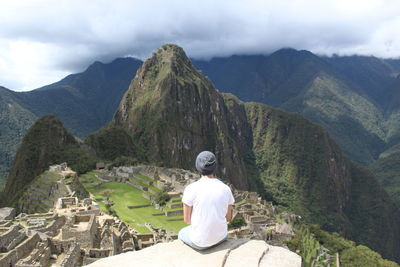 Rear view of man looking at mountain