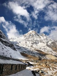 Scenic view of snowcapped mountains against sky