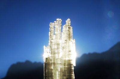 High section of building against blue sky