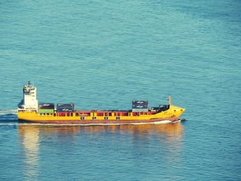 Boat sailing on sea against sky