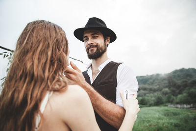 Young couple standing outdoors