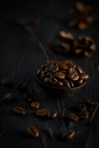 Close-up of roasted coffee beans on table