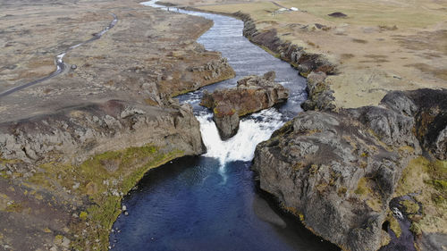 Aerial view of hjalparfoss waterfall in southwest iceland