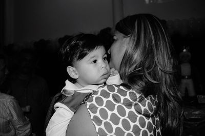 Close-up of mother and daughter at home