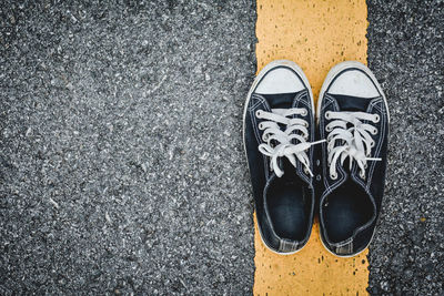 Close-up of a pair of black canvas shoes