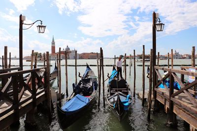 Panoramic view of boats moored at dock