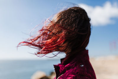 Midsection of woman against sky