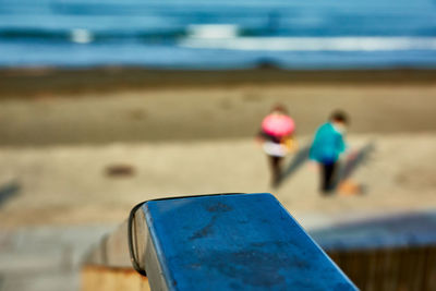 Rear view of people on beach