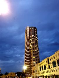Low angle view of illuminated building against sky