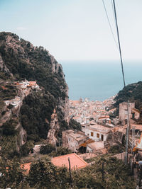 Townscape by sea against sky