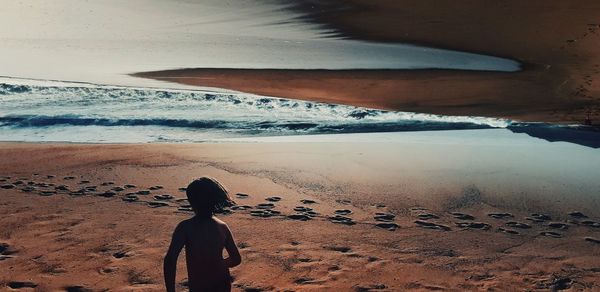 Digital composite image of girl at beach