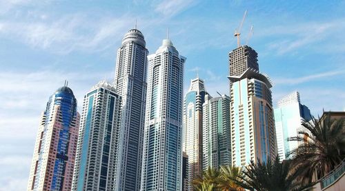 Low angle view of modern skyscraper against sky