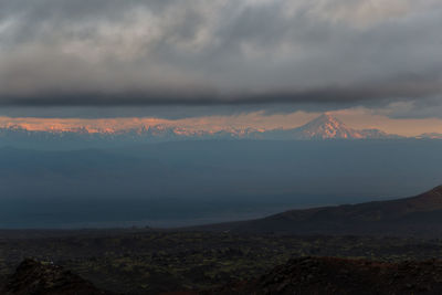 Scenic view of mountains against sky during sunset