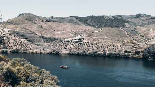 High angle view of townscape by sea against sky