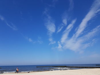 Scenic view of sea against blue sky