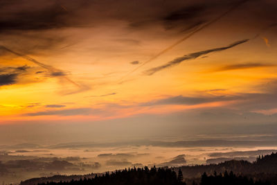 Scenic view of silhouette landscape against romantic sky at sunset