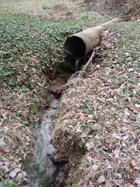 High angle view of water pipe on field