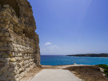 Scenic view of sea against blue sky