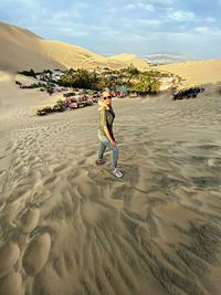 Woman standing at desert