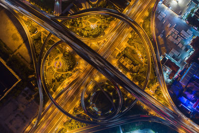 High angle view of light trails on road in city