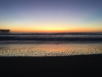 Scenic view of sea against clear sky during sunset