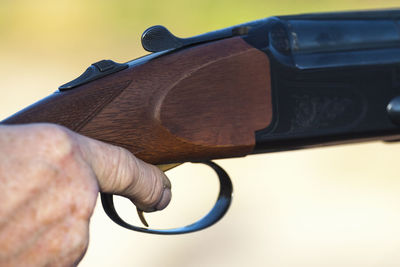 Cropped hand shooting gun