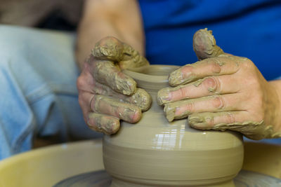 Close-up of man holding hands