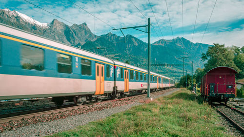 Train on railroad track against sky
