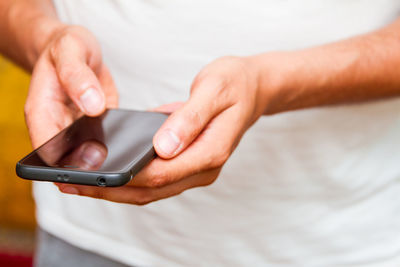 Close-up of person using mobile phone