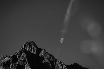 Low angle view of rocks against sky