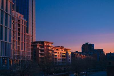 Modern buildings against blue sky