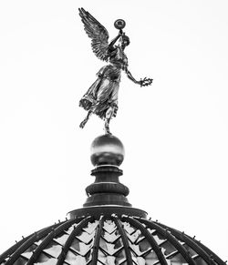 Low angle view of statue against sky